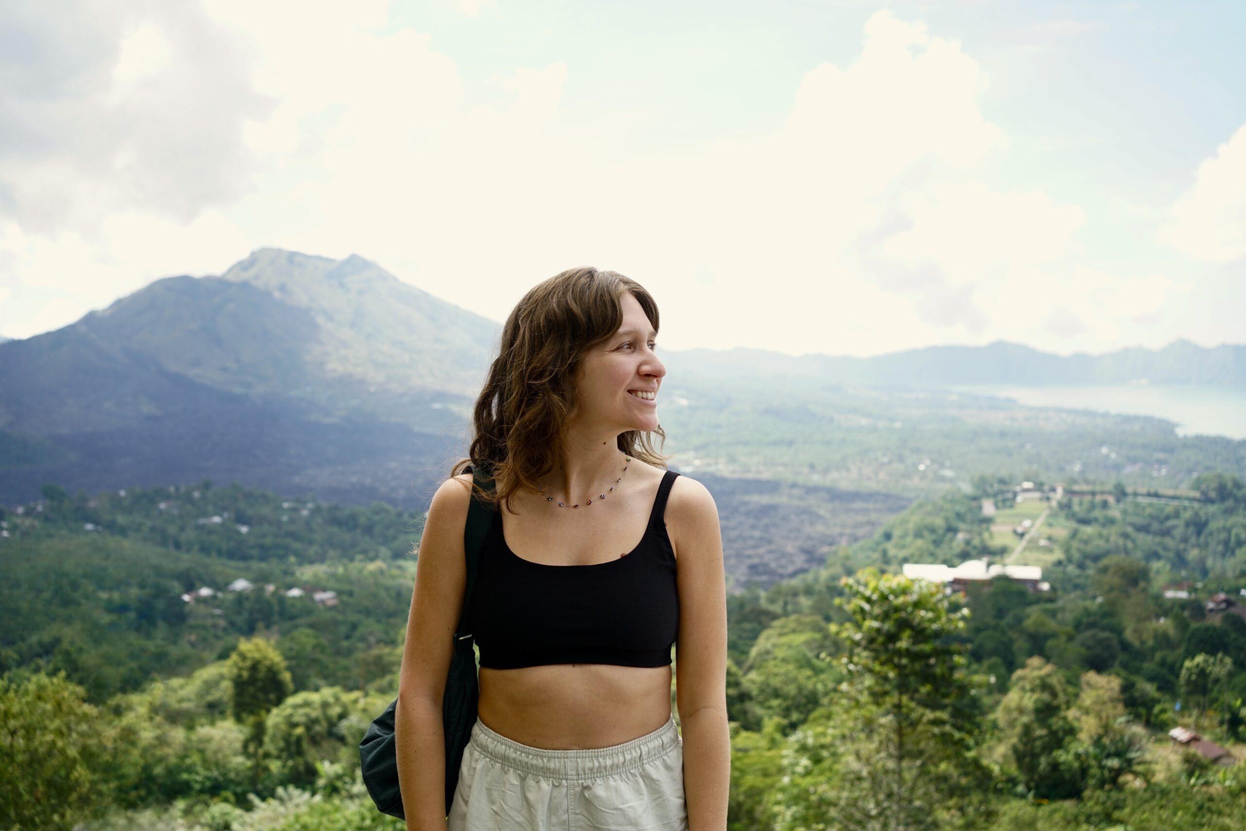 A woman looking over at Mount Batur in the distance