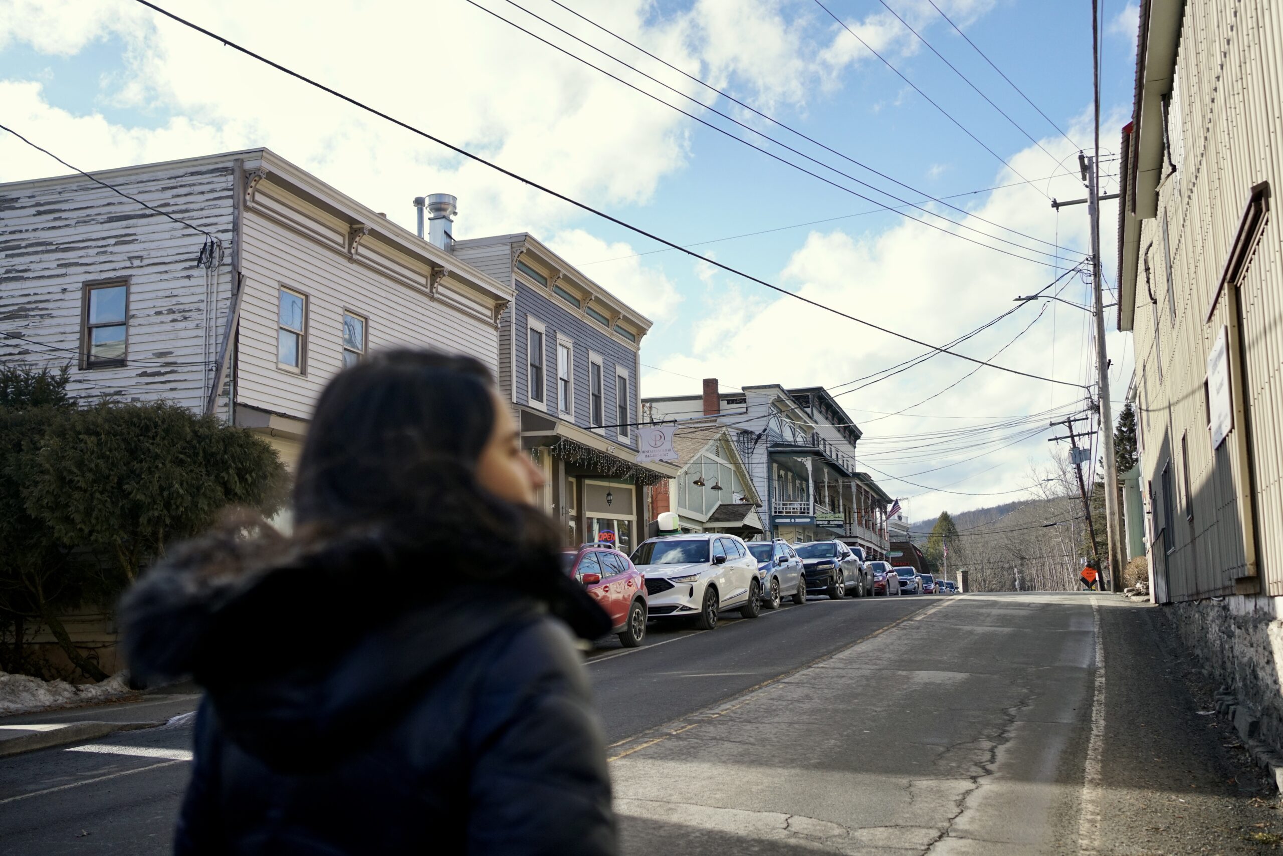 A woman walks down the street of the main street in Calicoon