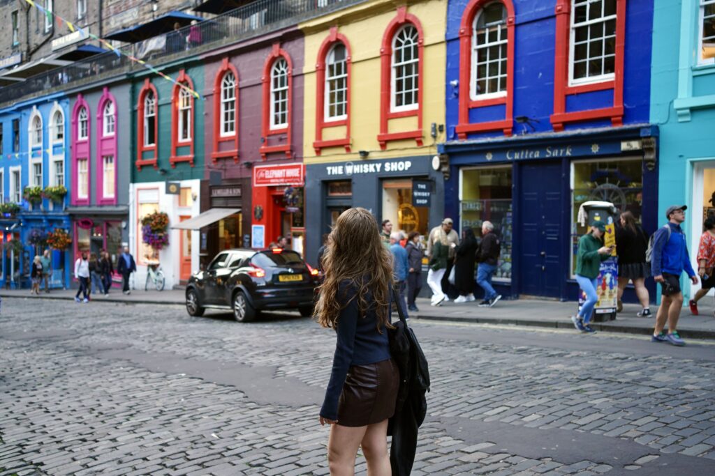 A woman stands in front of Victoria Street