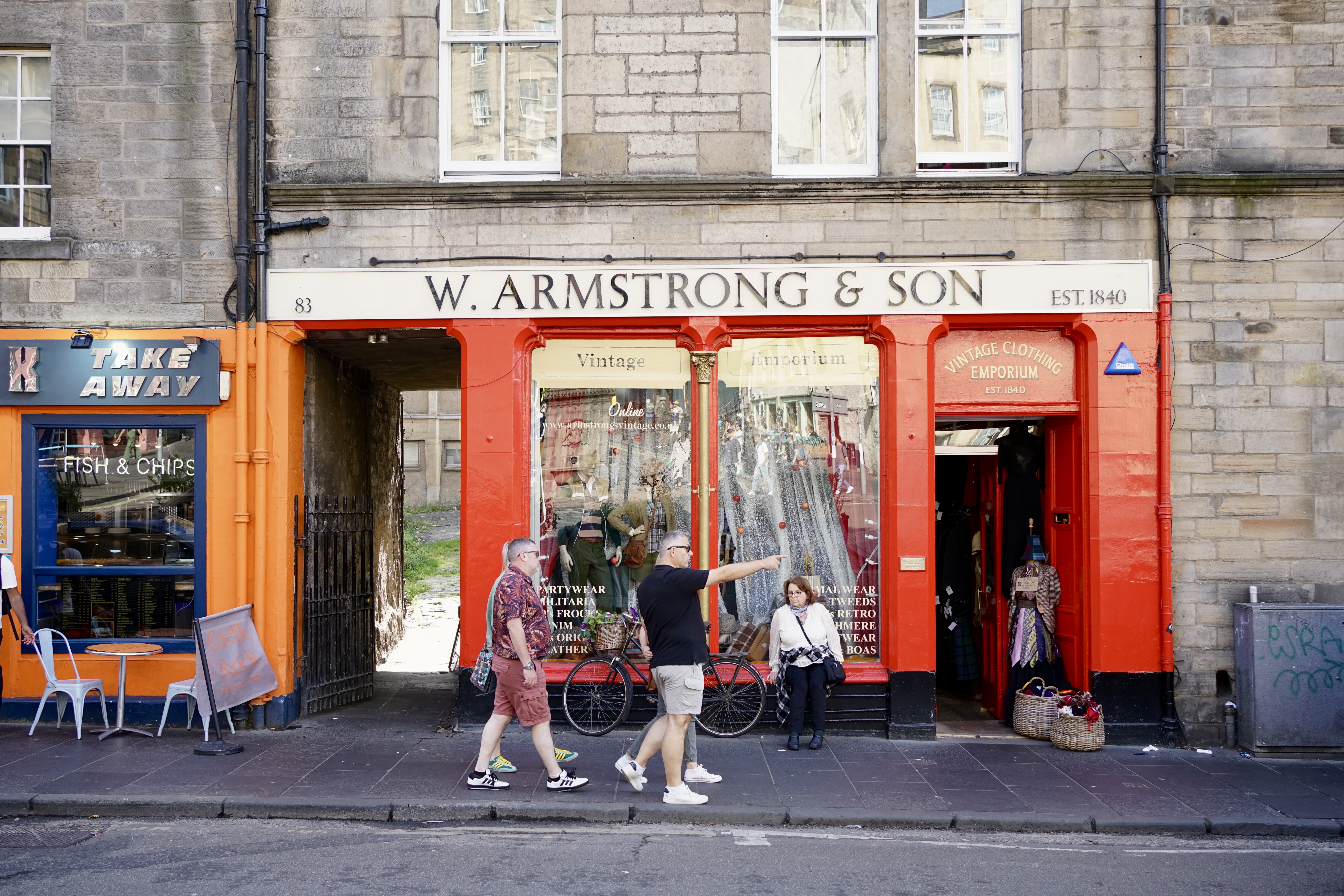 People walking outside of a vintage shop in Edinburgh