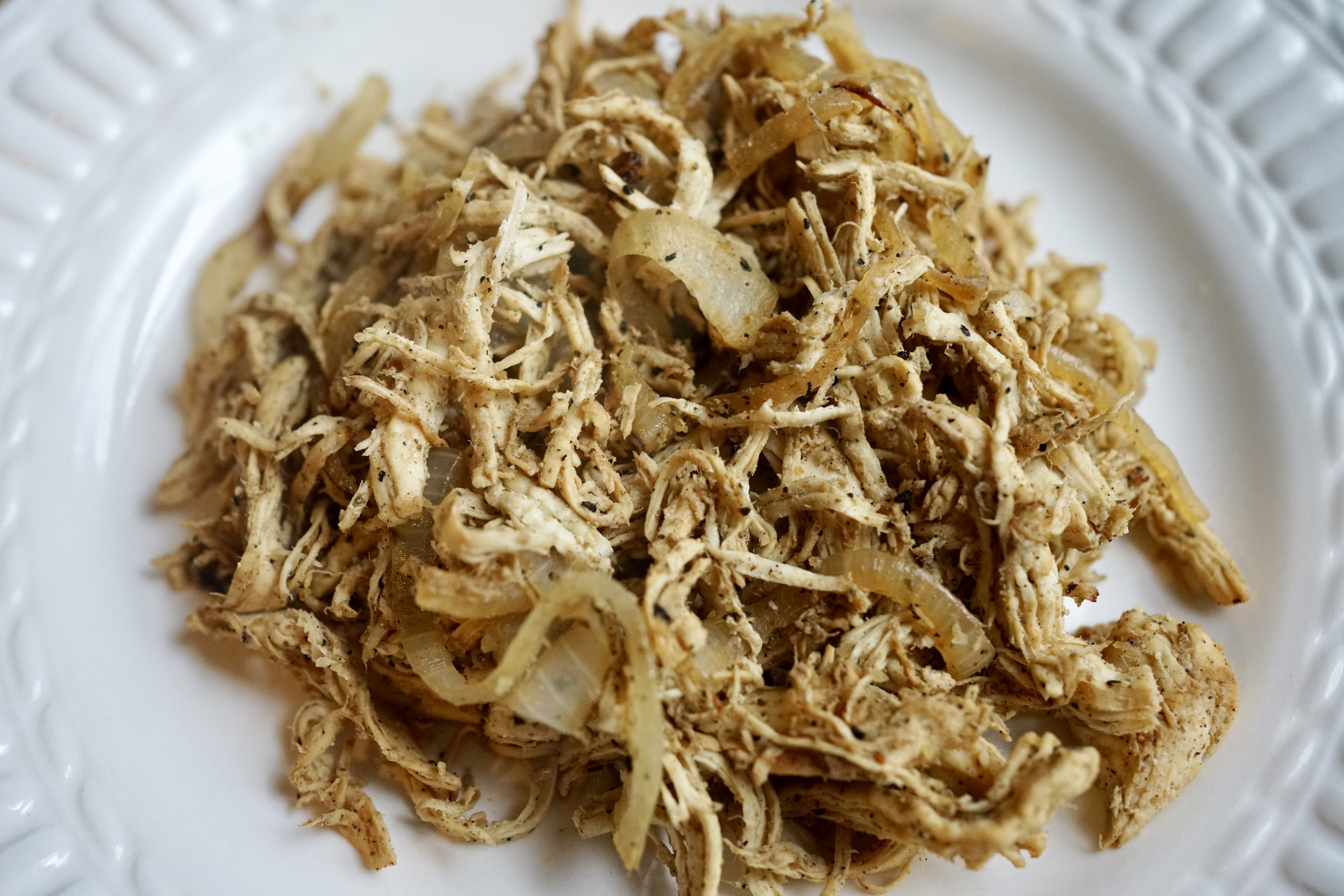 Cuban shredded chicken with onions on a plate