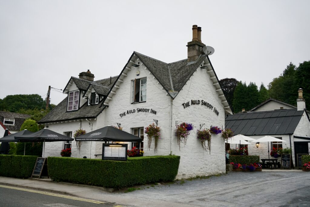 A white cottage in a small town in Scotland