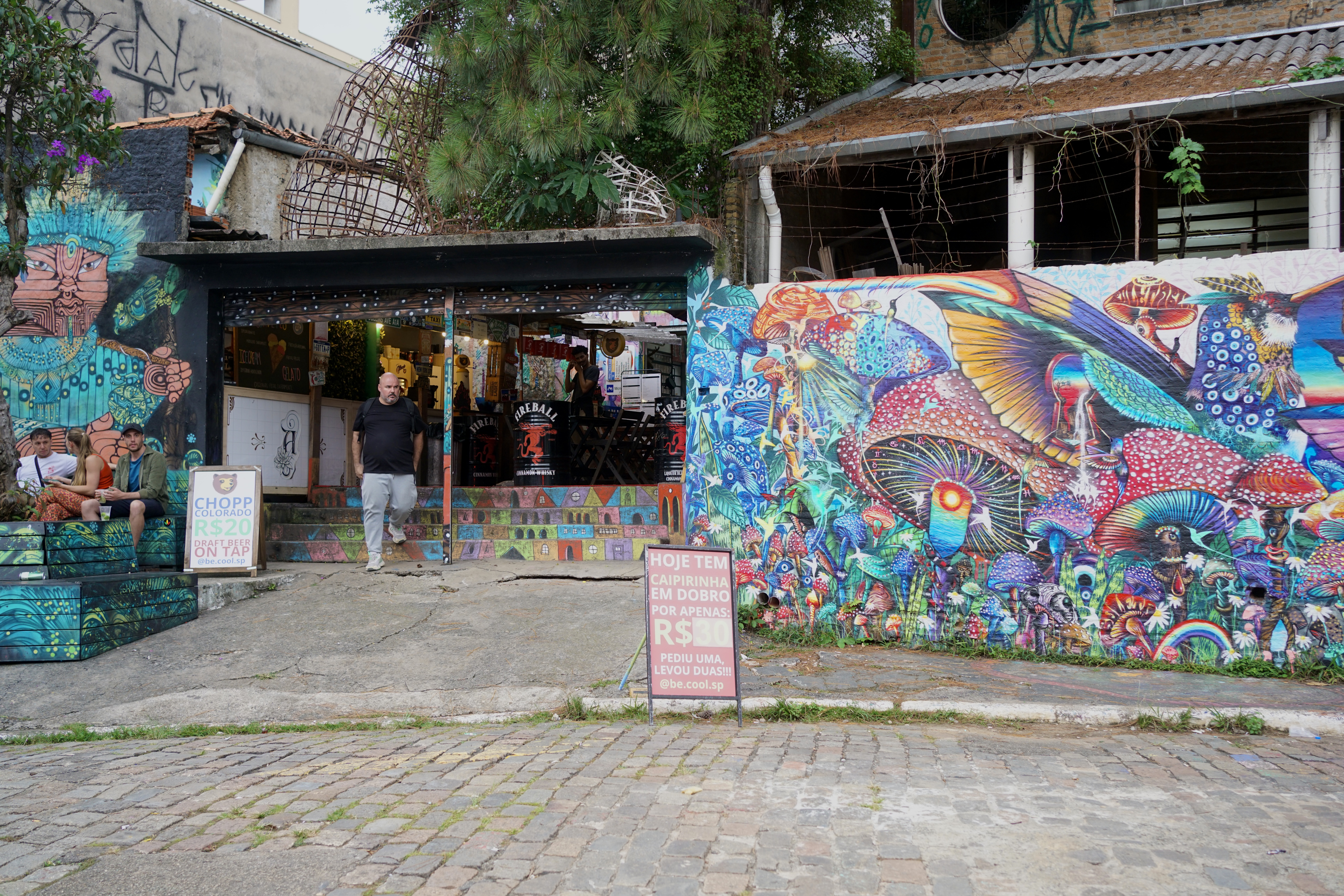 A man walks out of an area in Beco do Batman
