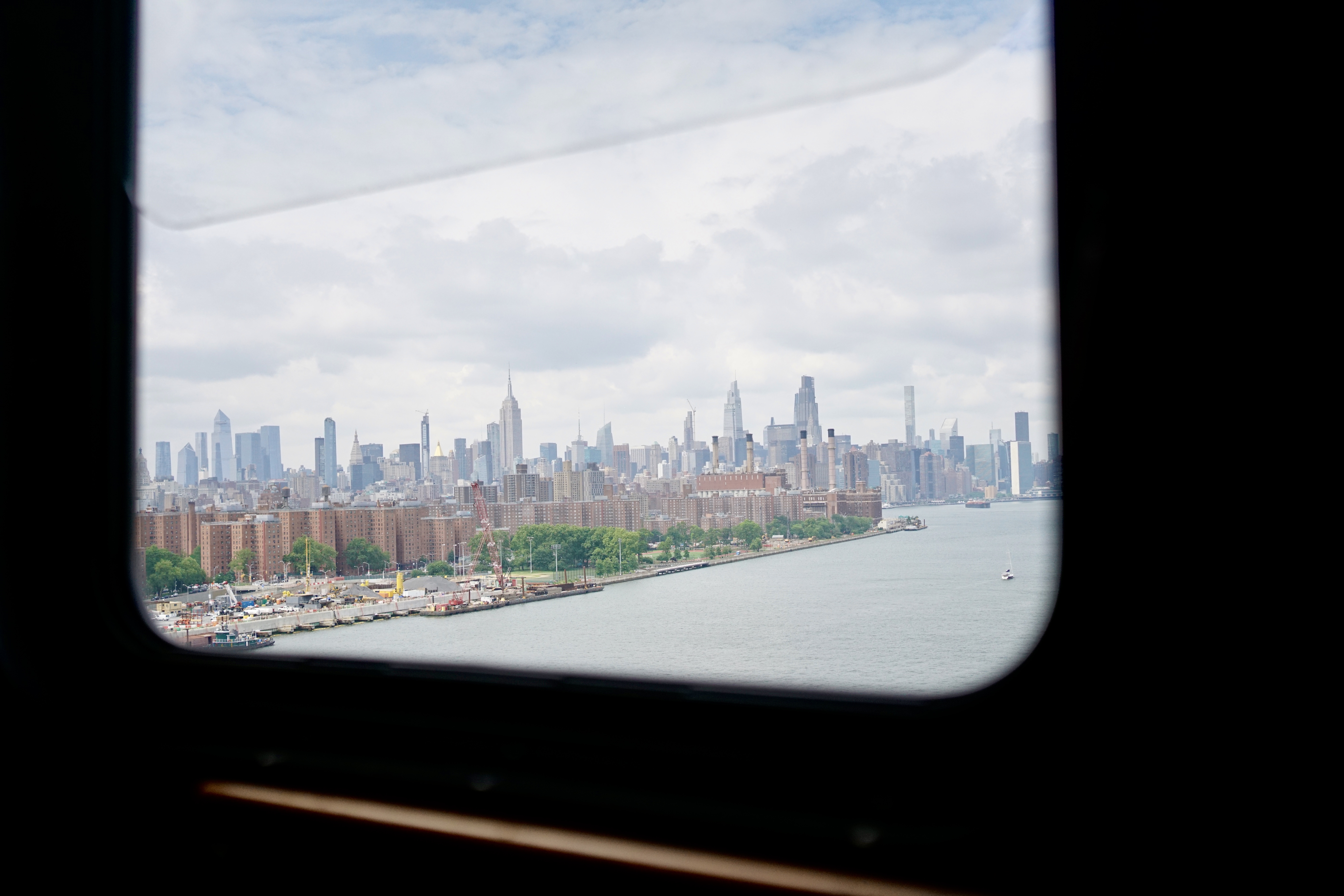 The view from a trolley window driving over the Williamsburg Bridge in New York City