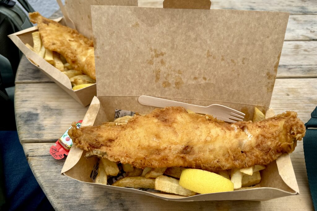 Fish and chips in a brown box for lunch