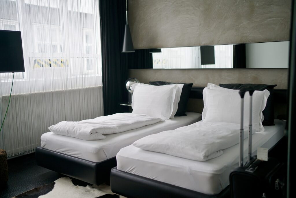 Two twin beds in a hotel room