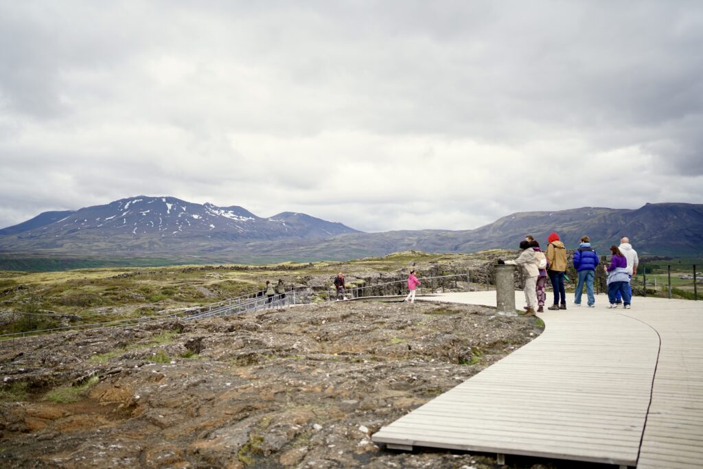 Visitors on a boardwalk at Þingvellir National Park