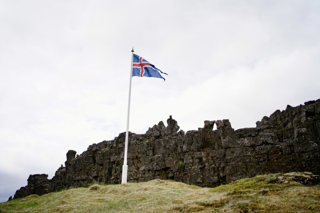 The iceland flag in the spot of Lögberg, the first parliament