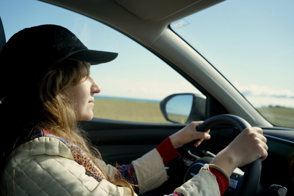 A woman driving on the Snæfellsnes Peninsula in Iceland