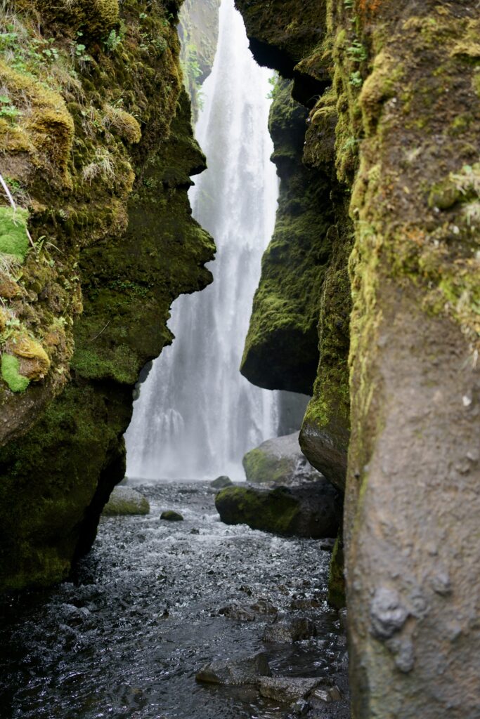A waterfall hidden in a cavern in Southern Iceland