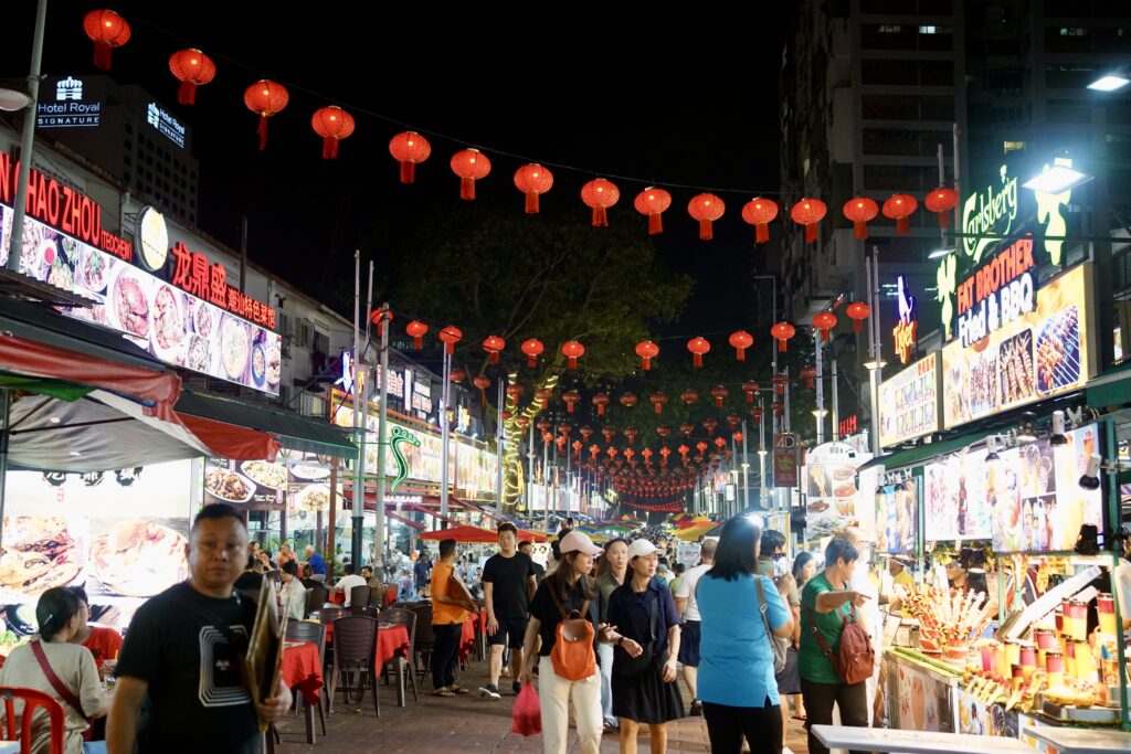 A night market with food vendors and red lanterns