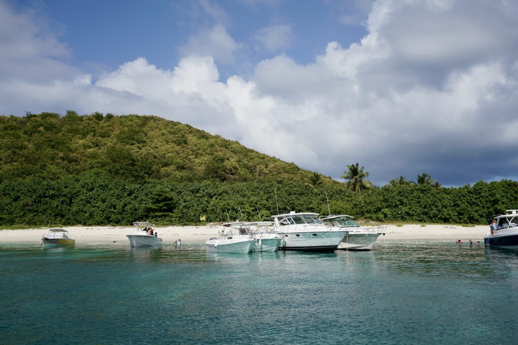 Boats anchored near an island