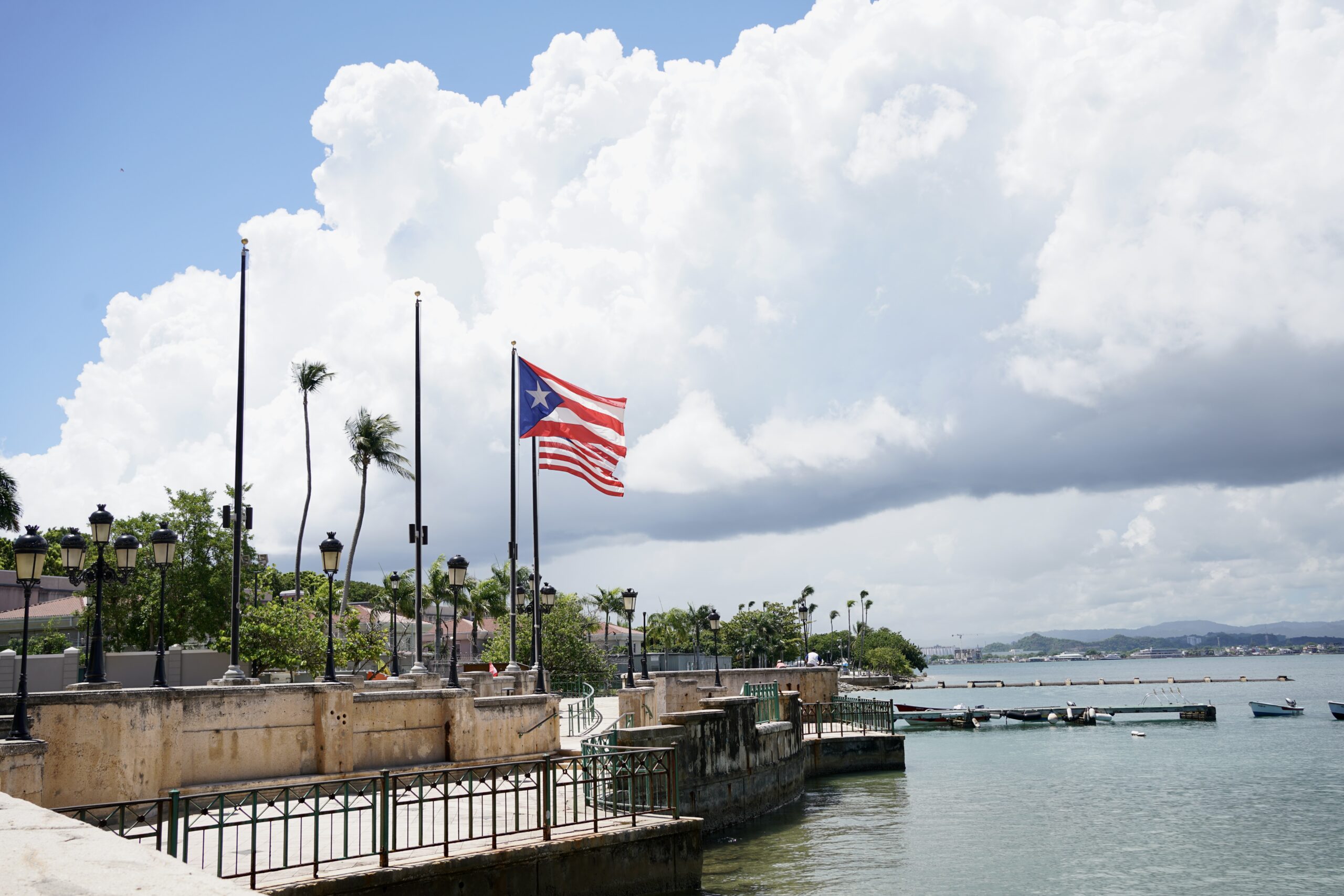 flags flying in the wind in viejo san juan