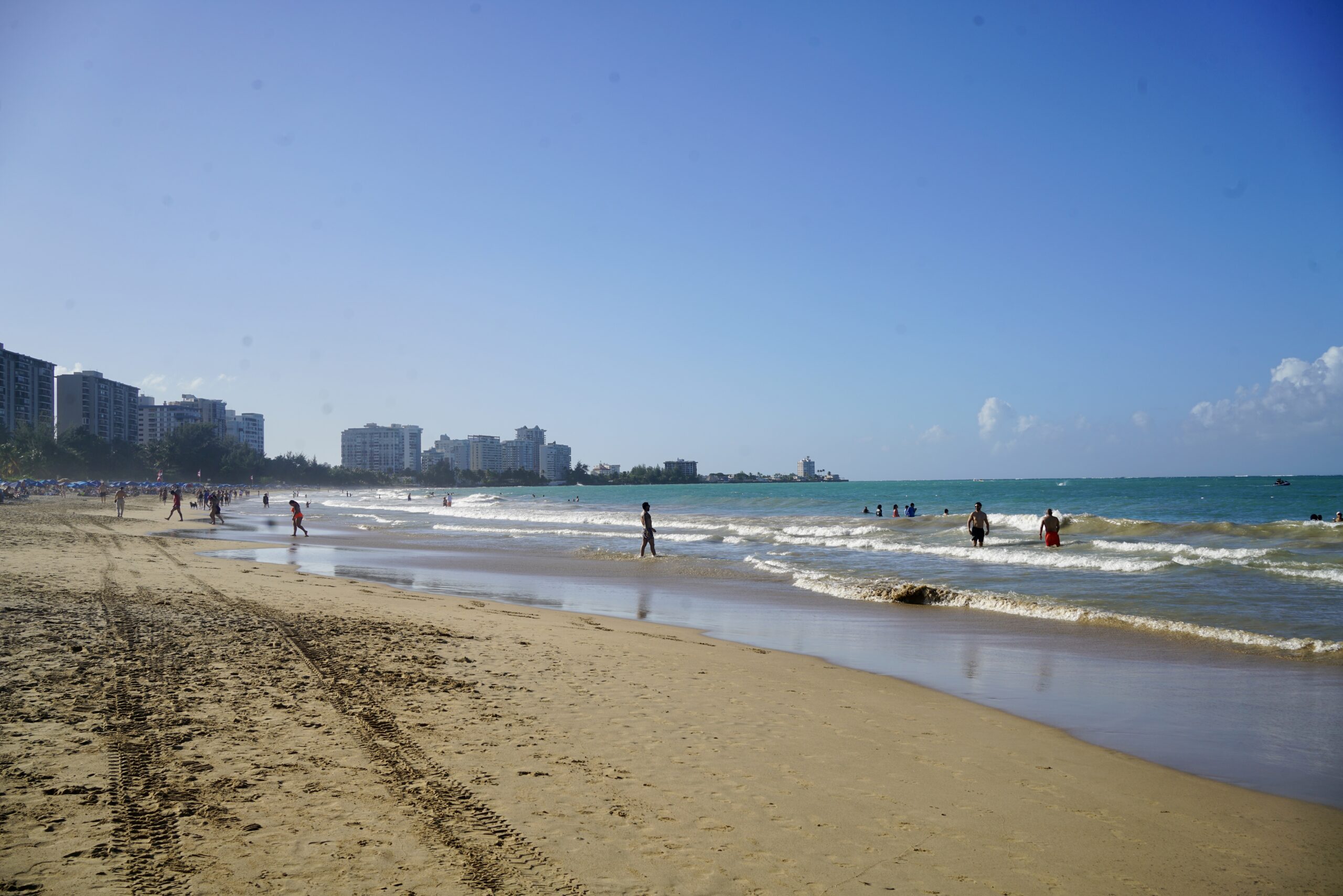 People along the shore in Isla Verde Beach