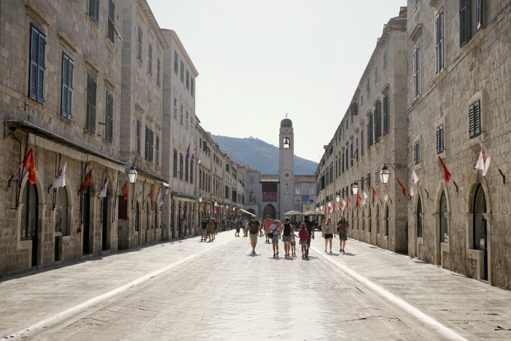 The main street in Dubrovnik's old town with the clock tower in the distance