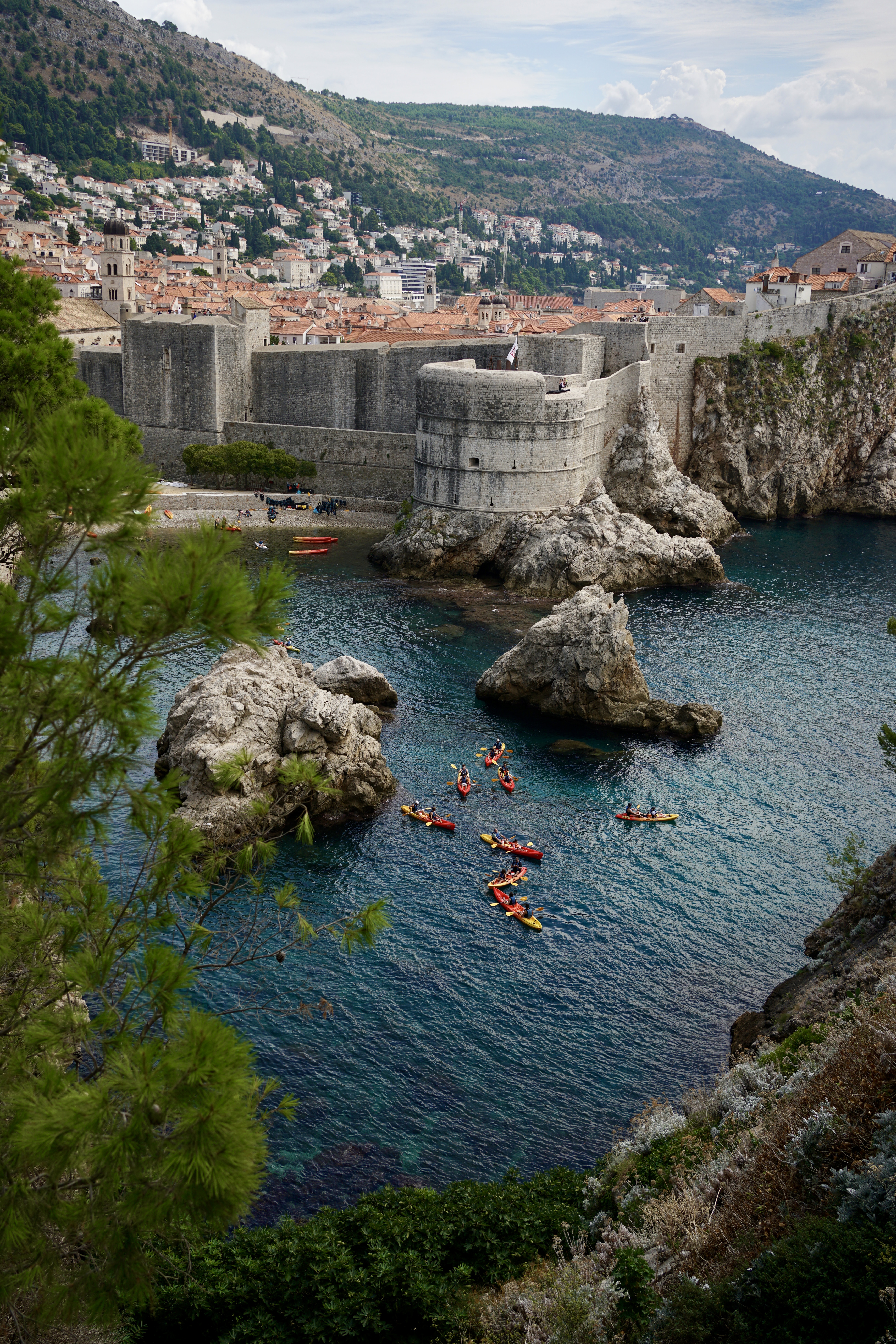 Kayaks in the water by the fortress in Dubrovnik