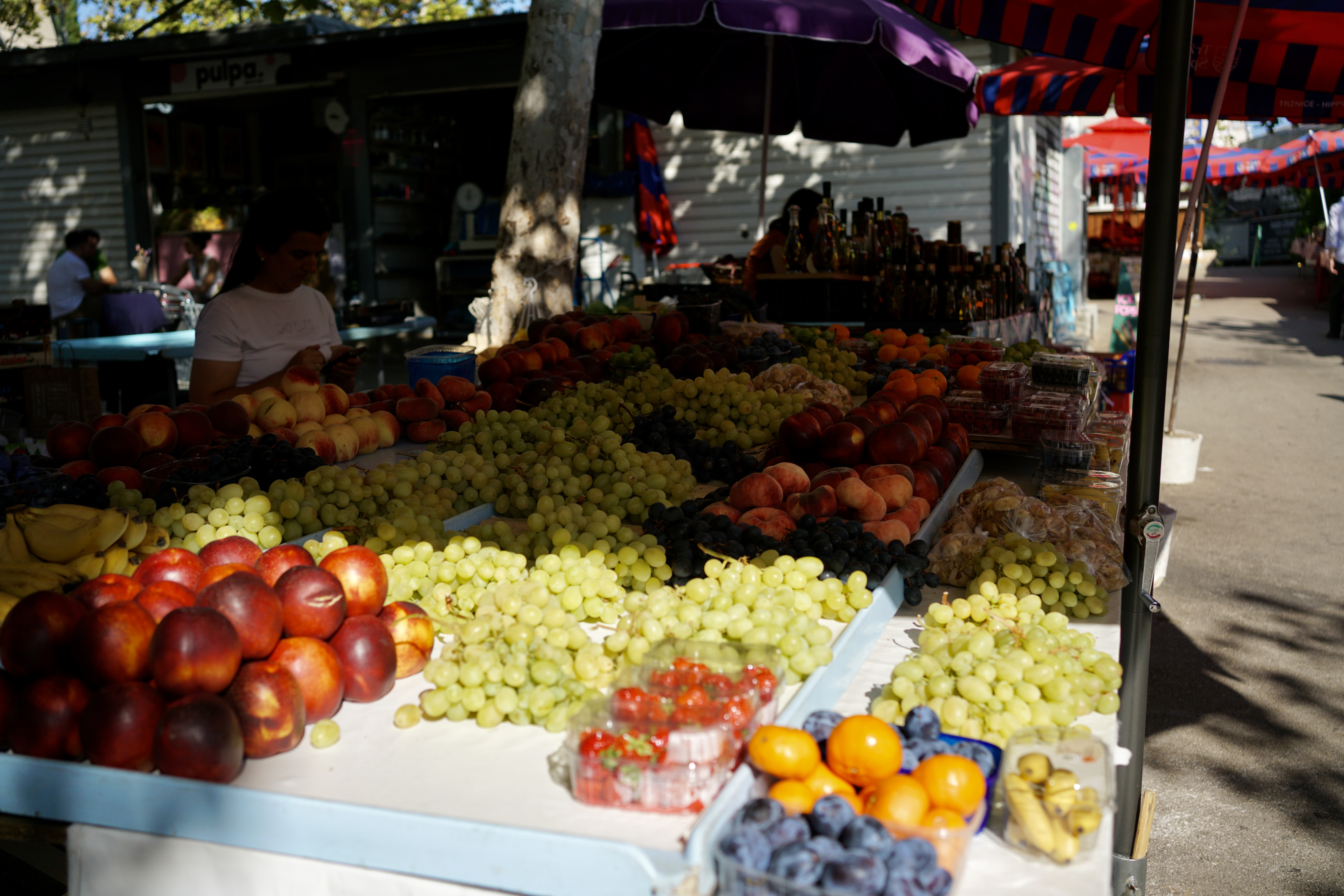grapes, plums, figs, and other fruits at a market in Croatia