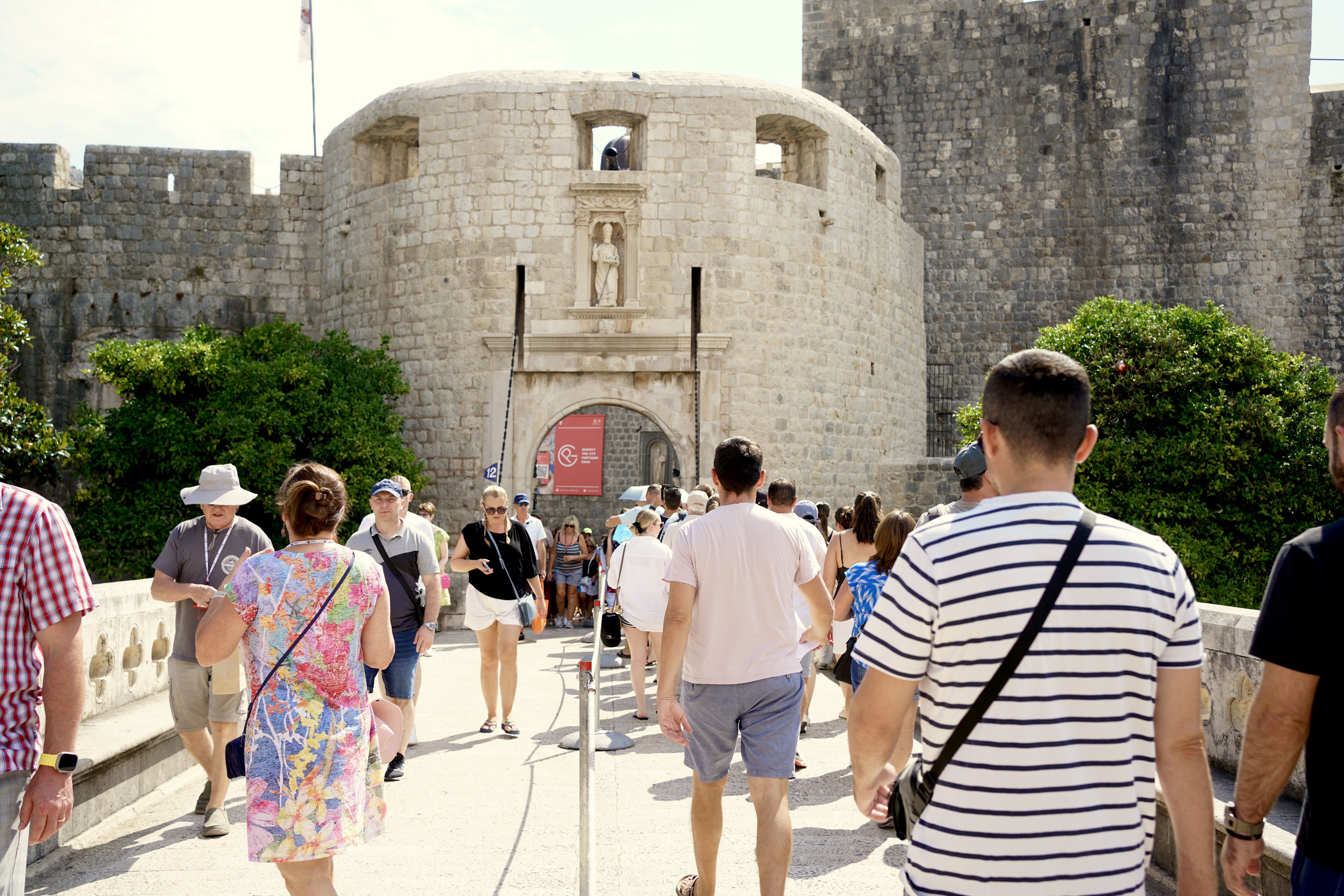 People walking into the Pile Gate of Dubrovnik