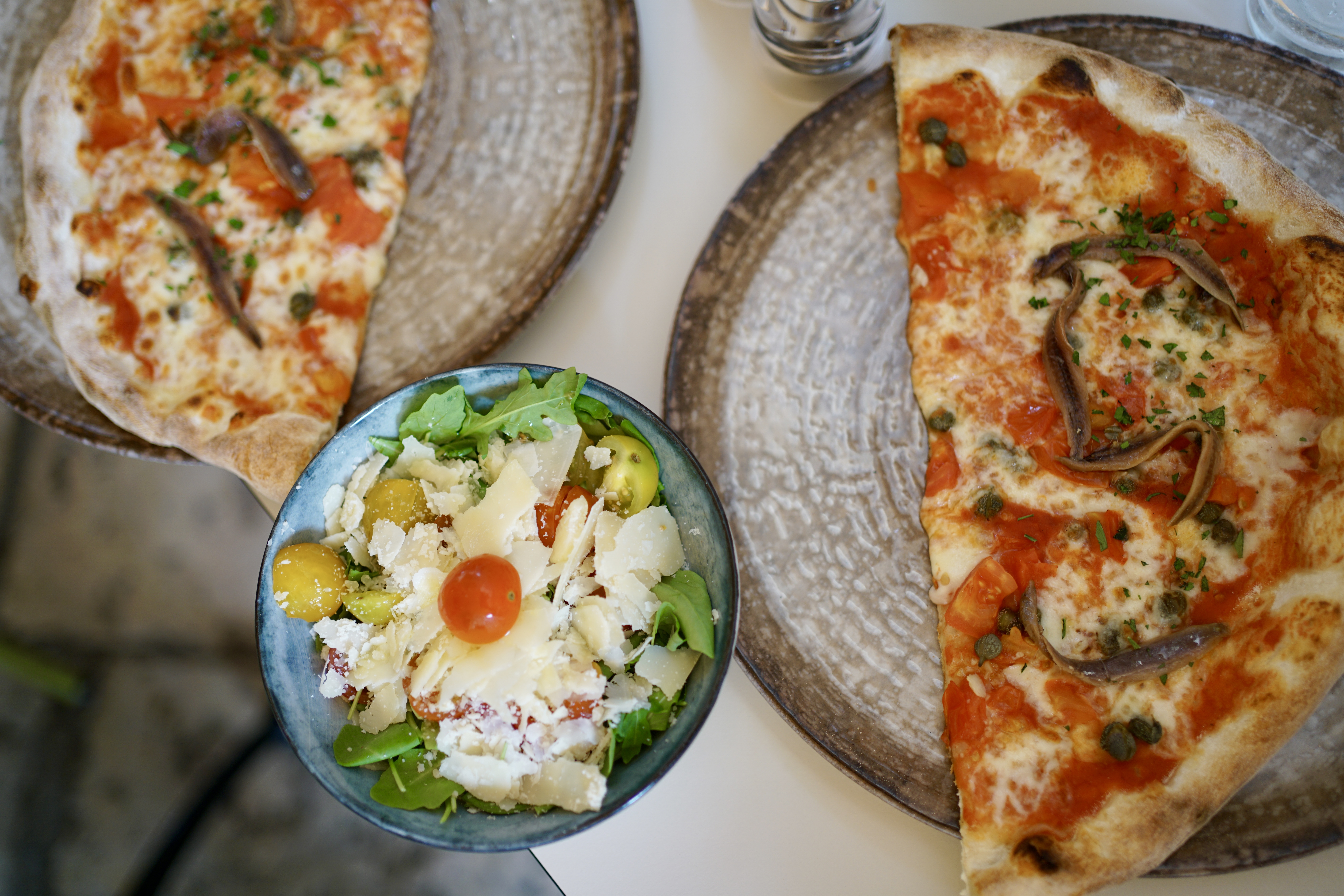 Two pizzas and a salad